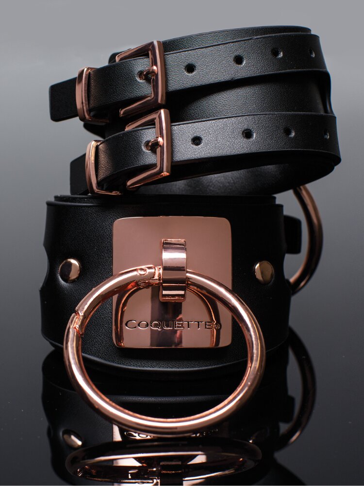 Black vegan leather and rose gold naughty handcuffs.  - Sensual Sinsations